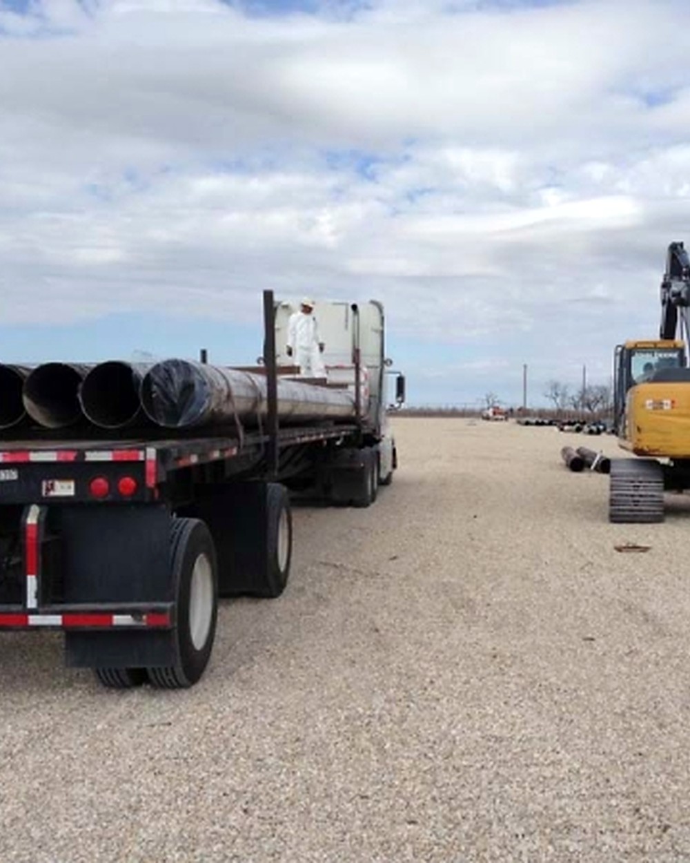 Recovered line pipe loaded on a flatbed ready to leave the yard